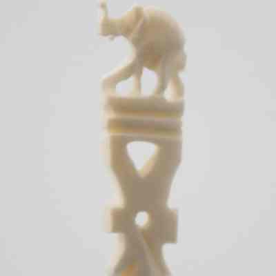 The end of one of the skewers.: Up close image of the end of one of the skewers. It depicts an elephant.