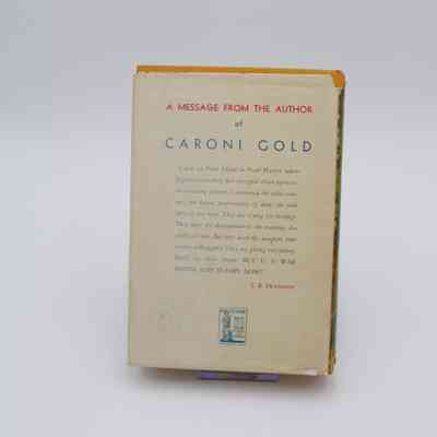 Back Cover: The back cover of “Caroni Gold” is on a white background and features a small message from the author.