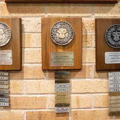 TAMU Association of Former Students Membership plaques: Three wooden plaques with Texas A&M seals honor Mr. Jordan’s consistent donations over various years.