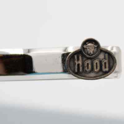 Hood emblem: The "Hood" emblem is a oval with a small cow head encircled above the "Hood" word.
