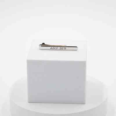 Engraving in back of tie bar: "AMP 26th" engraved into the back of the tie bar.
