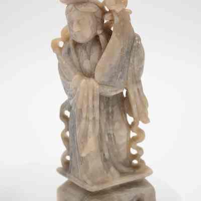 Woman playing an instrument soapstone figurine.: One of two carved soapstone figurines. This one features a woman holding a Chinese lute, known as a pipa.