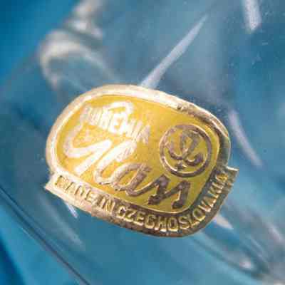 Sticker on the tea glasses.: Image of the silver and yellow sticker on the glass teacup. It reads "BOHEMIA Glass" with the company logo and "MADE IN CZECHOSLOVAKIA."