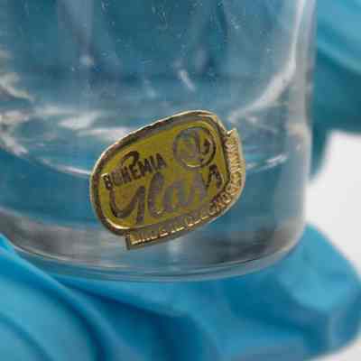 Sticker on the tea glasses.: Image of the silver and yellow sticker on the glass teacup. It reads "Bohemia Glass" with the company logo and "Made in Czechoslovakia."
