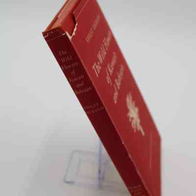 Spine of "The Wild Flowers of Kuwait and Bahrain": The spine has the title, author and publisher.