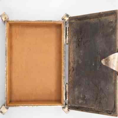 Inside of cigarette box: Inside of cigarette box has a wooden lining inside.