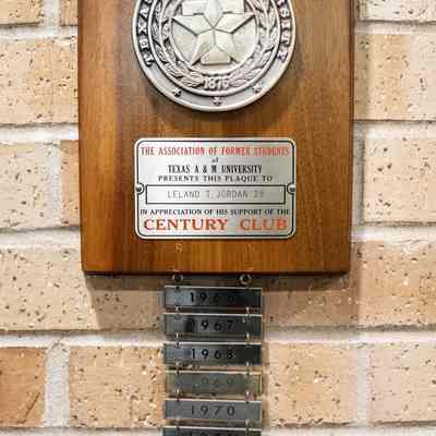 Century club plaque: The image shows a wooden plaque from Texas A&M University honoring Mr. Jordan's donations.