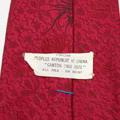 Tie label: The red silk tie features a floral pattern and a label indicating "From Peoples Republic of China; Canton Fair 1972"