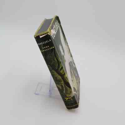 Book Spine of "Venezuela": The spine of "Venezuela" features the book title, author's last name, and logo of the publisher.