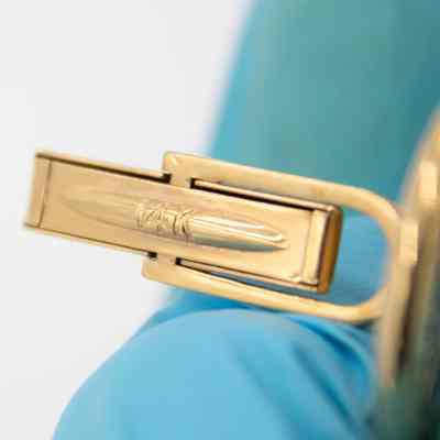 Back of one of the gold cufflinks given to Mr. L.T. Jordan by William Alton Jones.: Up close image of the back of one of the gold cufflinks. It is engraved with "14K."
