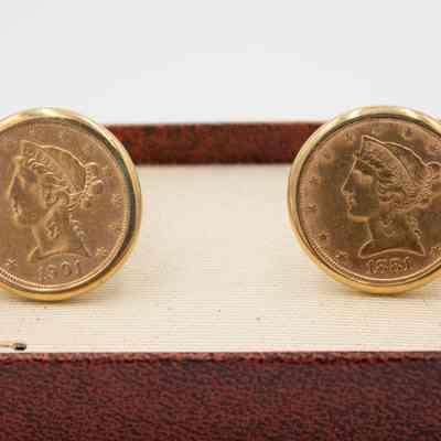 Gold cufflinks given to Mr. L.T. Jordan by William Alton Jones.: Up close image of the set of cufflinks, they are 14k gold with a gold liberty head double eagle coin set into them. One coin is dated 1901 and the other 1881.