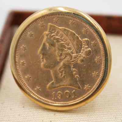 One of the gold cufflinks given to Mr. L.T. Jordan by William Alton Jones.: Up close image of one of cufflinks, they are 14k gold with a gold liberty head double eagle coin set into them. One coin is dated 1901 and the other 1881.