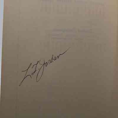 L.T. Jordan signed in front cover: Off-white book page inside front cover shows "L.T. Jordan" signed in black pen.