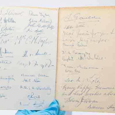 Inside the back cover of the program from the 1961 Ladies' Festival at the Kuwait Masonic Lodge No. 6810.: Image of the inside back cover of the program signed with the names of attendees in blue ink. The back inside cover is yellowed and the back page is lighter yellow