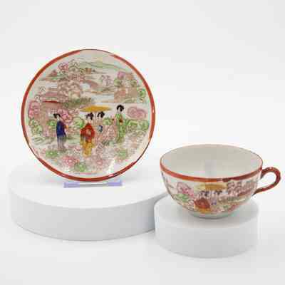 Hand-Painted Japanese Porcelain Cup and Saucer with Garden Scene