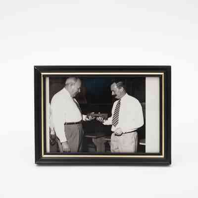 Photograph of L.T. Jordan Receiving Miniature Yard of Ale
