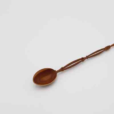 Carved Dark Brown Wooden Spoon