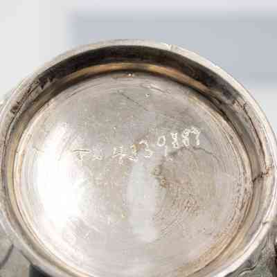 Engraving in bottom of creamer: Engravings in bottom of "TX 4339887"
