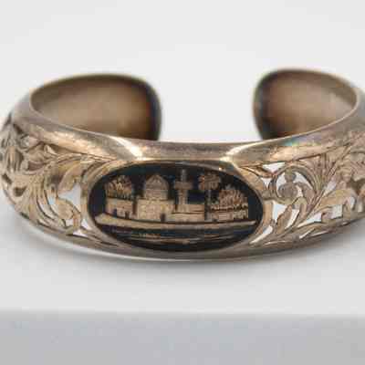 Silver Cuff Bracelet with Arabesque Carvings and Town Scene