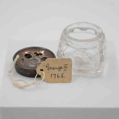 Note inside one bottle: A small tag stored inside the bottle, "George III 1765."