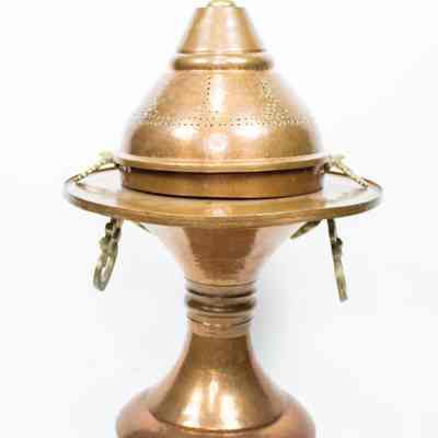Large brazier: The image shows an elegant pedestal copper brazier with a domed cover, featuring intricate perforations and ornate handles.