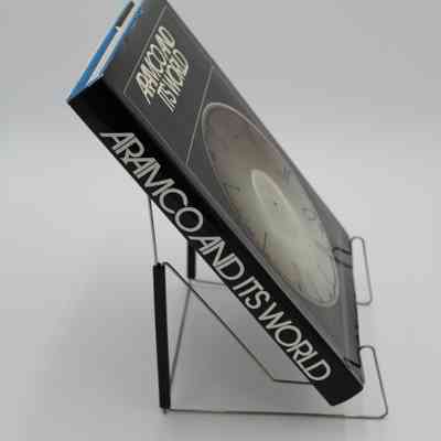 Book Spine: The spine of “Aramco and its World" features the book title in white.