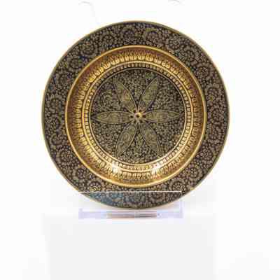 Brass ashtrays with designs: The image shows a brass ashtray with intricate black floral motifs.