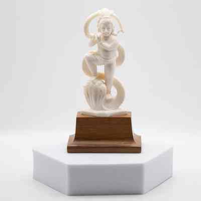 Carved Ivory Lord Krishna Playing the Flute on Wooden Base