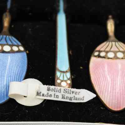 Solid silver label: A label across the spoons says, "Solid Silver; Made in England."
