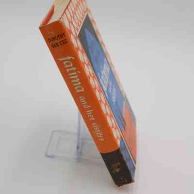 Spine for “Fatima and her Sisters”: The book spine for “Fatima and her Sisters” is orange with the name of the author, book, and publisher featured.