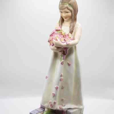 Ceramic Figurine of Girl Holding Flowers