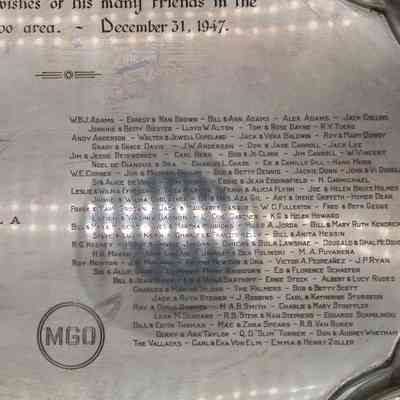 Silver tray: A long list of dedications engraved into the tray next to a "MGO" logo.