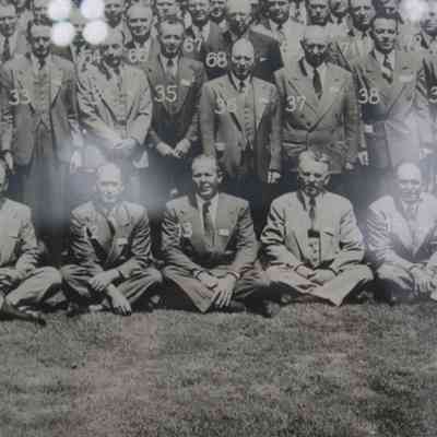 L.T.J. in conference photo: A close up of the attendees, centered on L.T.J. He is sitting cross-legged and labeled #13.