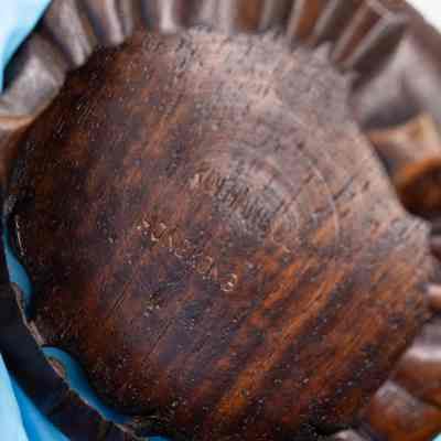 Bottom of stand: Dark teakwood stand with, "Hong Kong."