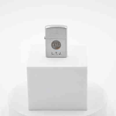 L.T.J. Gulf Oil Company Zippo: The steel lighter centrally has a circle with "GULF" in big letters, with "L. T. J." engraved underneath.