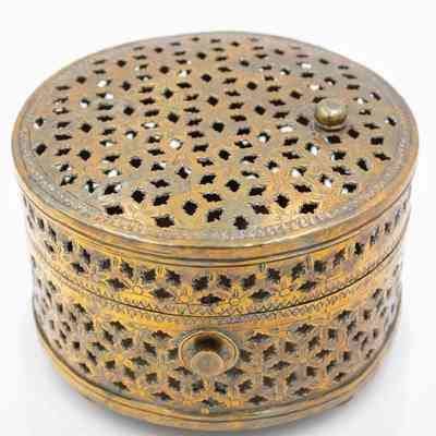 Brass mesh box: The ornate brass box features intricate floral patterns with perforations decorating its surface.