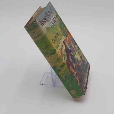 Spine of "Young Man of Caracas": The spine has images of foliage, as well as the title, author and publishers logo.
