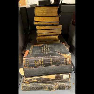 Two stacks of books; varying conditions.