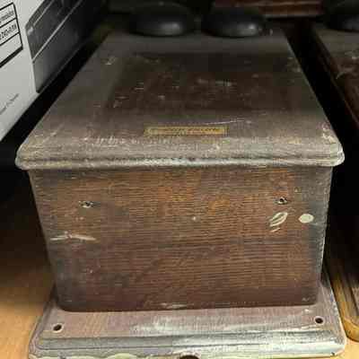 Western Electric wood-cased wall telephone (partial).