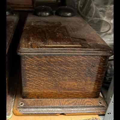 Western Electric wood-cased wall telephone (partial).