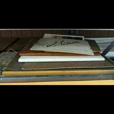 Stack of photographs and documents.
