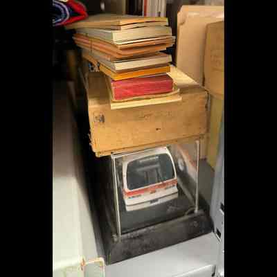 Bus model in vitrine; ticket books.