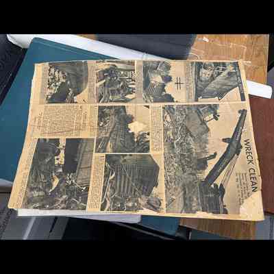 Newspaper page documenting recovery of derailment.