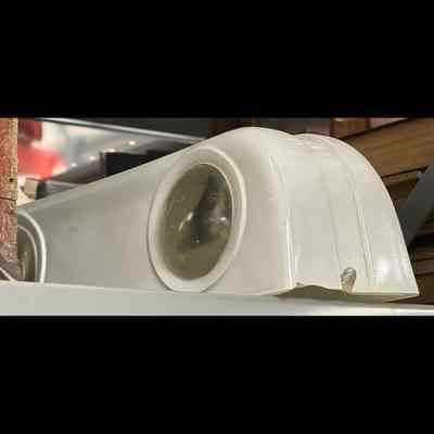 Glass object (lamp shade). Two round lenses with white glass surround. Rectangular.
