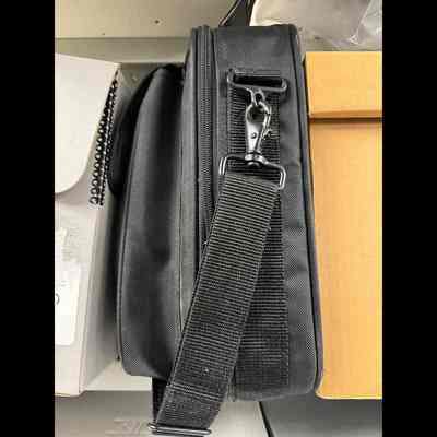 Computer laptop in black laptop bag.