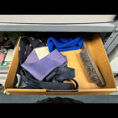 Document box lid with dress tie steel brush knit cap etc.