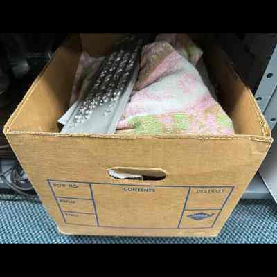 Metal ID plate for railcar, wrapped in blanket.