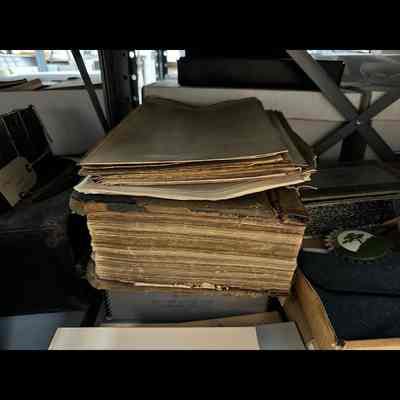 Papers and old ledger/binder.