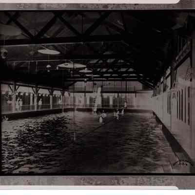 Negative of people swimming in Natatorium