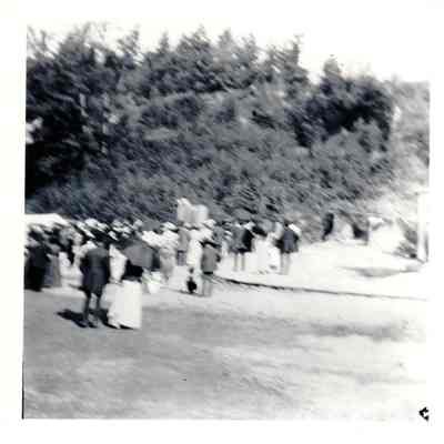 Crowd of people likely near Coney Island Bathhouse